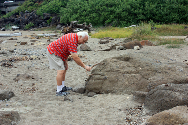 Lee Duquette playing drums on a rock